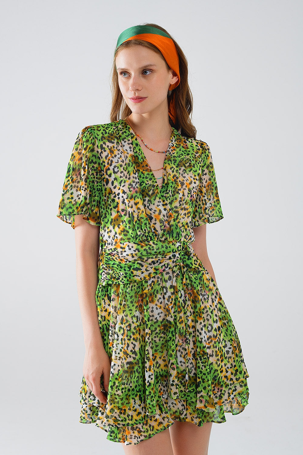Abito corto verde multicolore con top incrociato con stampa animalier